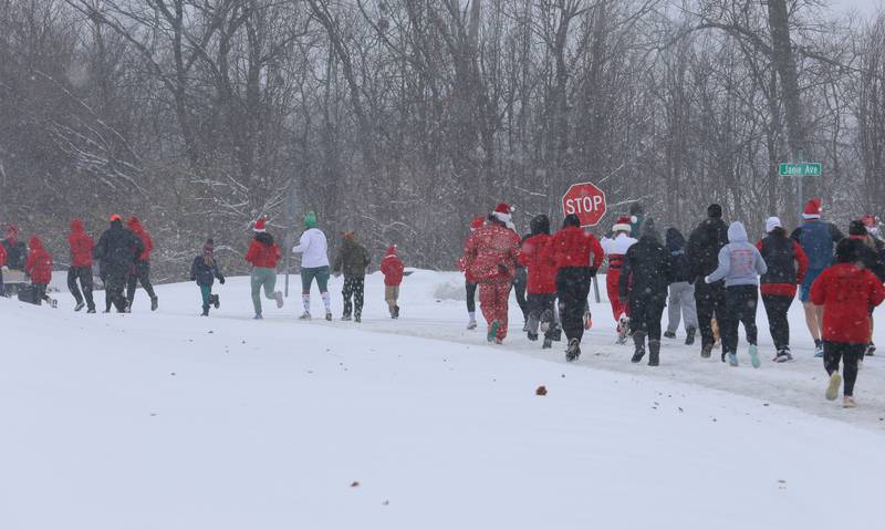 Over 100 runners begin the race during the Santas on the Run 5K and one-mile walk on Saturday, Nov. 29, 2025 in Spring Valley.