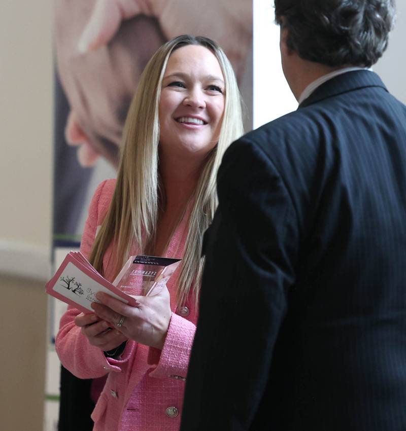 Heather Martines accepts the Spirit of Small Business Award on behalf of Sycamore Orthodontics and Pediatric Dentistry Thursday, March 5, 2026, during the Sycamore Chamber of Commerce Annual Meeting in Memorial Hall at St. Mary's Catholic Church in Sycamore.