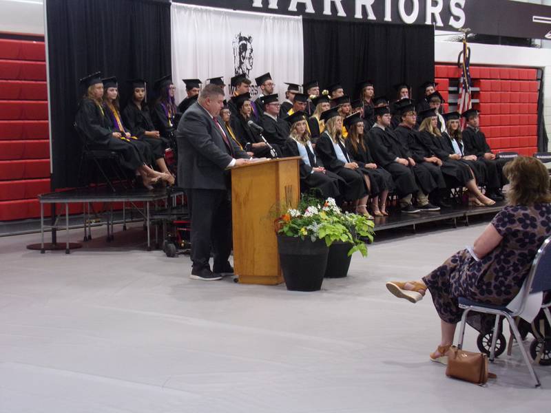 Woodland Superintendent Ryan McGuckin addresses the Class of 2023 during the high school's graduation ceremony May 21, 2023, in the Warrior Dome gym.