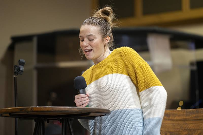 Abby Ryan says a few words about Peace and Justice Award winner Sterling schools counselor Christine Herren Sunday, Jan. 19, 2025.