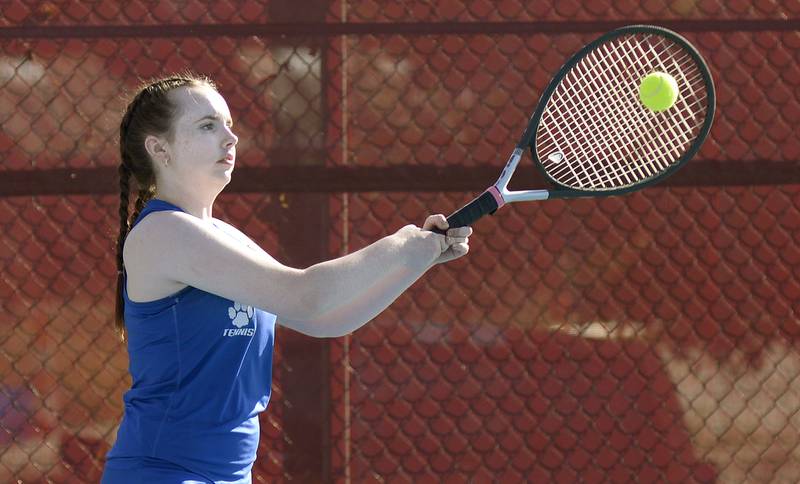 Princeton # 1 Singles Tessa Carlson returns a serve against Streator Tuesday at Streator.