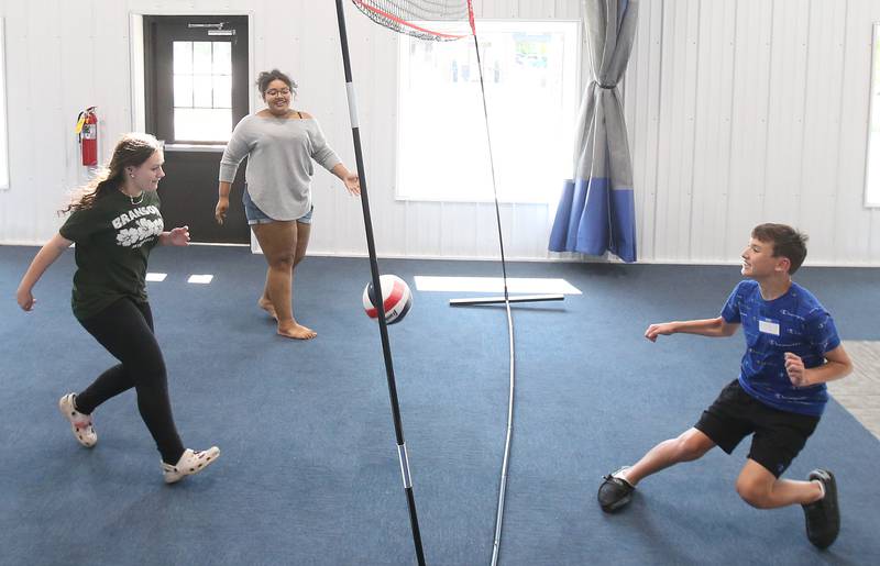 Tahleyah Carter, Gianna Crowl and Nick Kleinfelter play volleyball during the Princeton Chamber of Commerce Business After Hours on Thursday, June 19, 2025 at the Second Story Teen Center in Princeton.