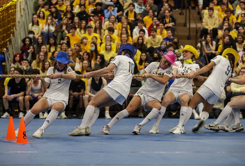The Lyons Township girls soccer team plays a game of tug of war during an all-school assembly in La Grange on Friday, April. 22, 2022.