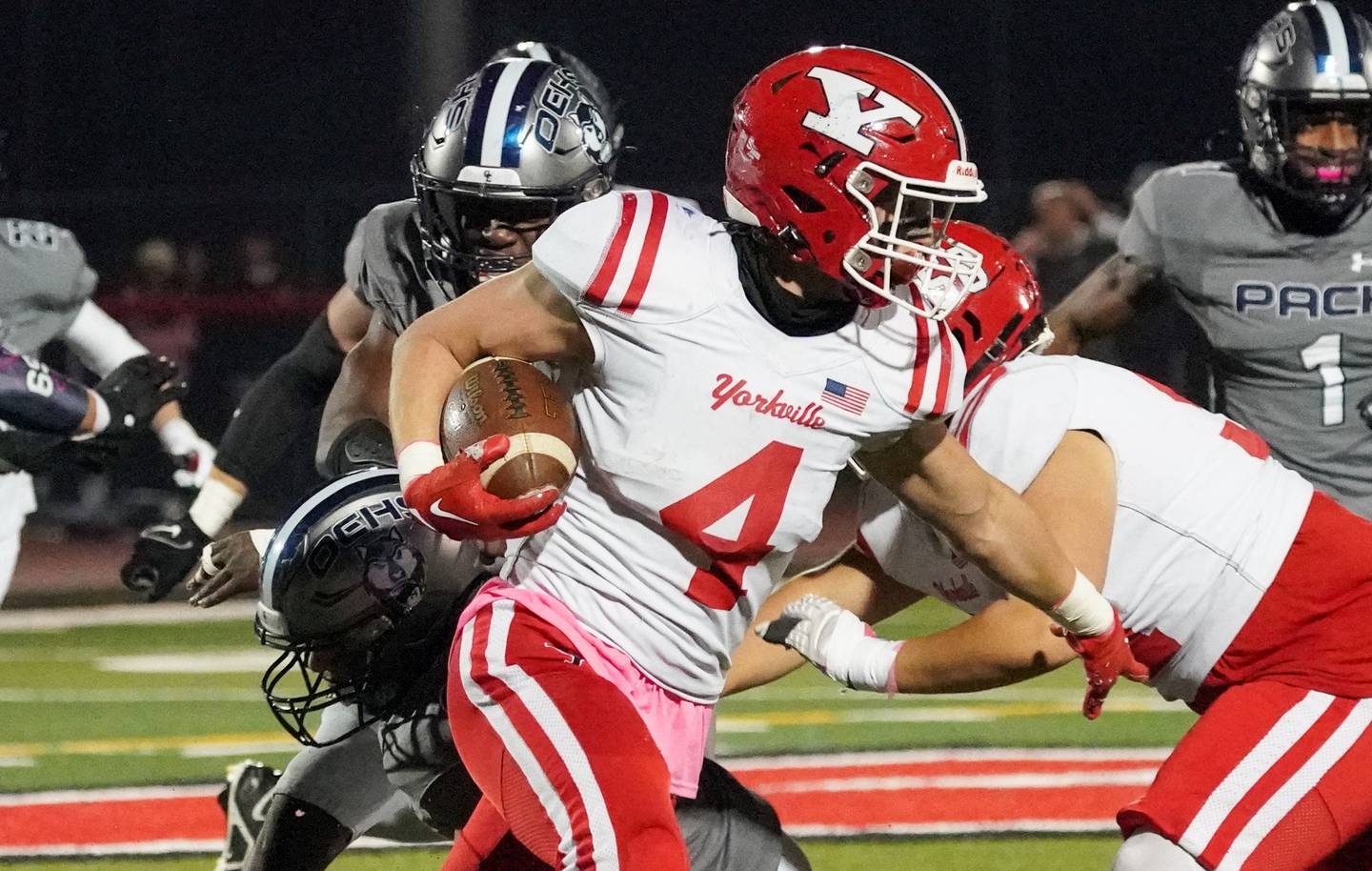 Yorkville's Josh Gettemy (4) carries the ball against Oswego East during a football game at Yorkville High School on Friday, Oct. 13, 2023.