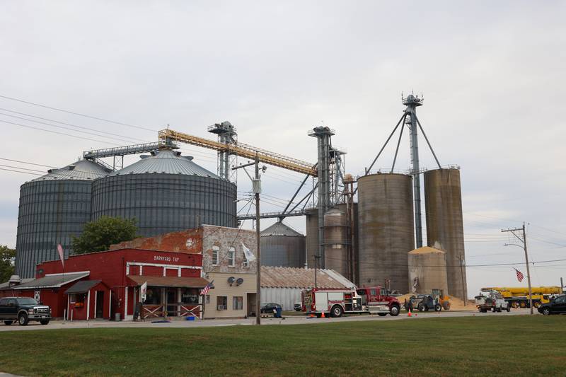 Emergency personnel close East Main Street in Martinton after a concrete grain bin collapsed on Wednesday, Oct. 15, 2025, at the Donovan Farmers Co-Op Elevator.