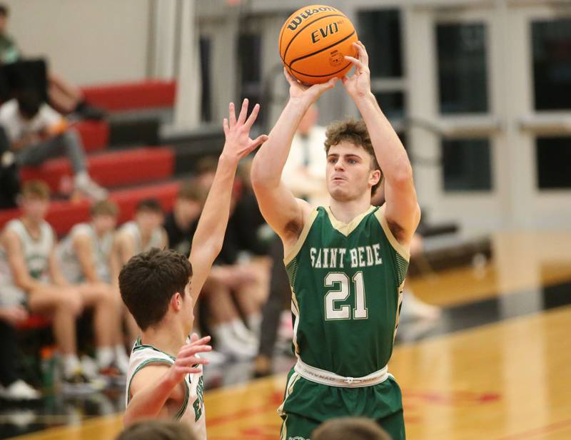 St. Bede's Gus Burr shoots a jump shot over Eureka's Cohen Alstat during the 50th annual Colmone Classic on Monday, Dec. 9, 2024 at Hall High School.