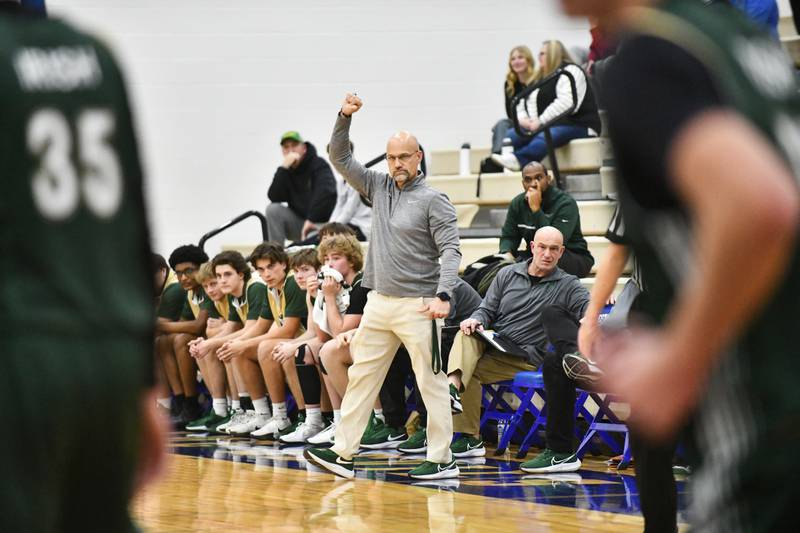 Bishop McNamara head coach Adrian Provost calls a play during the Fightin' Irish's 79-67 victory over Joliet Catholic Academy in the IHSA Class 2A Peotone Sectional semifinal on March 4, 2025.