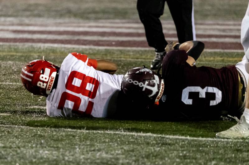 Lockport's Colton Benaitis tackles Homewood-Flossmoor's Kourtney Smith during an 8A varsity football playoff game at Lockport Township High School East Campus on Nov. 8, 2025.