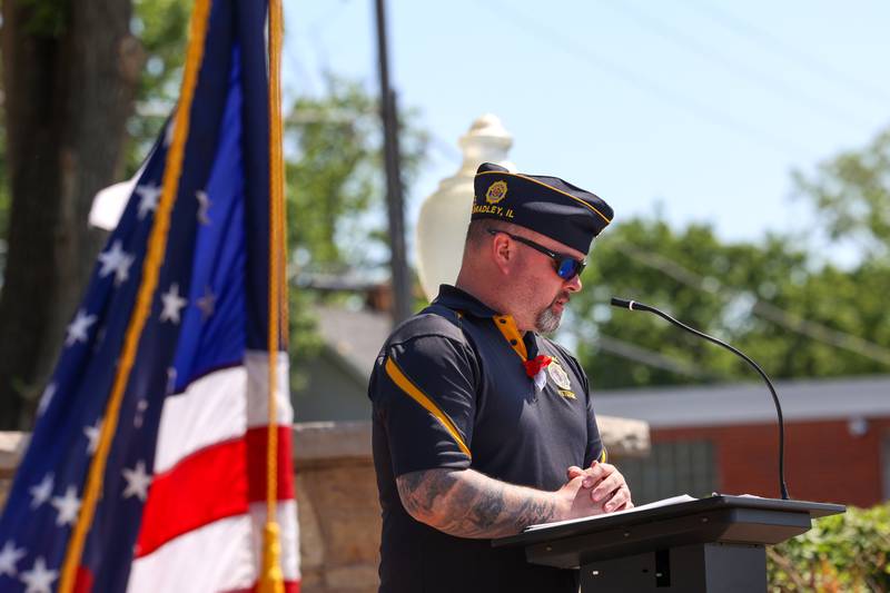 Bradley American Legion Commander Corey Norton reads a poem written by a veteran during the Legion's Memorial Day ceremony on Monday, May 25, 2026.