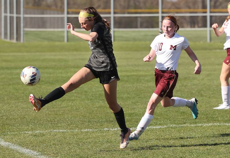 Sycamore's Oliviana Maniaci tries to keep the ball in bounds in front of Morris' Danica Martin during their Interstate 8 Conference Tournament semifinal game Wednesday, May 3, 2023, at Sycamore High School.