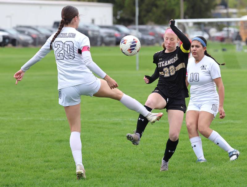 Kaneland's Erin Doucette (left) and Sycamore's Cortni Kruizenga try to win possession during their game Wednesday, April 29, 2026, at Sycamore High School.