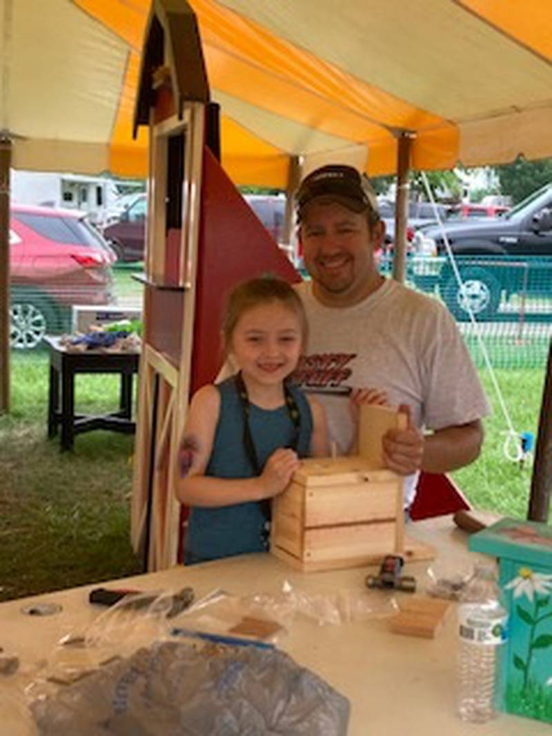Kevin Knapp, of Magnolia, builds a birdhouse with his daughter Madison.