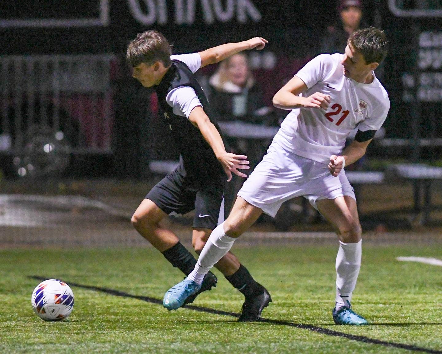Prairie Ridge's Joshua Marineau, left, and Benet Academy's Brendan Bergnach (21) battle for the ball during the class 2A super sectional soccer match in November 2024 held at Wheaton Academy in West Chicago.