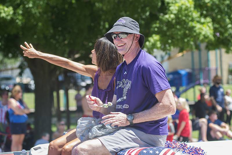 Petunia parade grand marshal Mike Grady gets ready to chuck some candy to eager kids as the Petunia parade moves through Dixon Sunday, July 3, 2022.