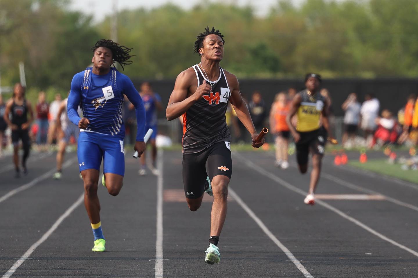 Minooka’s DJ Smith crosses the finish line first in the 4x100 Meter Relay at the Class 3A Minooka Boys Track and Field Sectional on Wednesday, May 17, 2023 in Minooka.