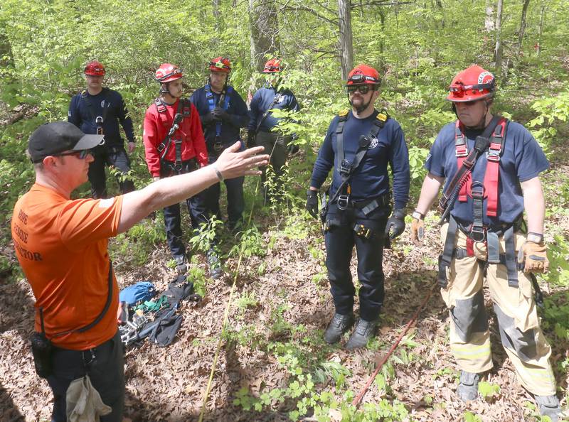 (Left) Jesse Poplawski from Normal Fire Department and the Illinois Fire Service Institute, talks to a group of Utica, Ottawa, Tonica, and Oglesby firefighters during rope rescue training on Saturday, May 2, 2026 in Wildcat Canyon at Starved Rock State Park.