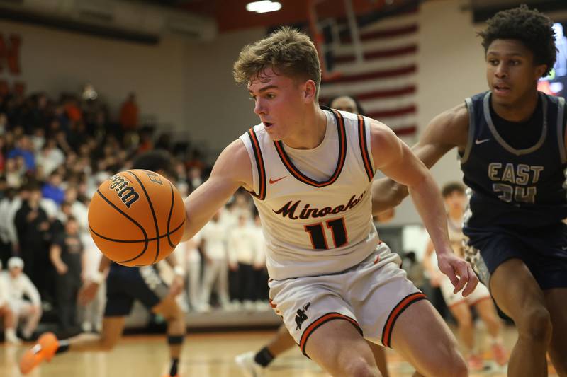 Minooka’s Brady Hairald recovers a loose ball against Oswego East on Friday, Jan. 16, 2026 in Minooka.
