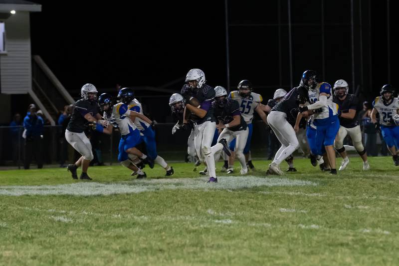 Wilmington's Hunter Kaitschuck runs the ball during the Wildcats' 49-7 victory over Tri-Valley in the quarterfinal game on Saturday, Nov. 15, 2025.