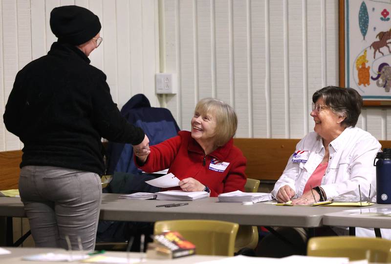 Election judges check in voters Tuesday, April 1, 2025, in the polling place at the Westminster Presbyterian Church in DeKalb.