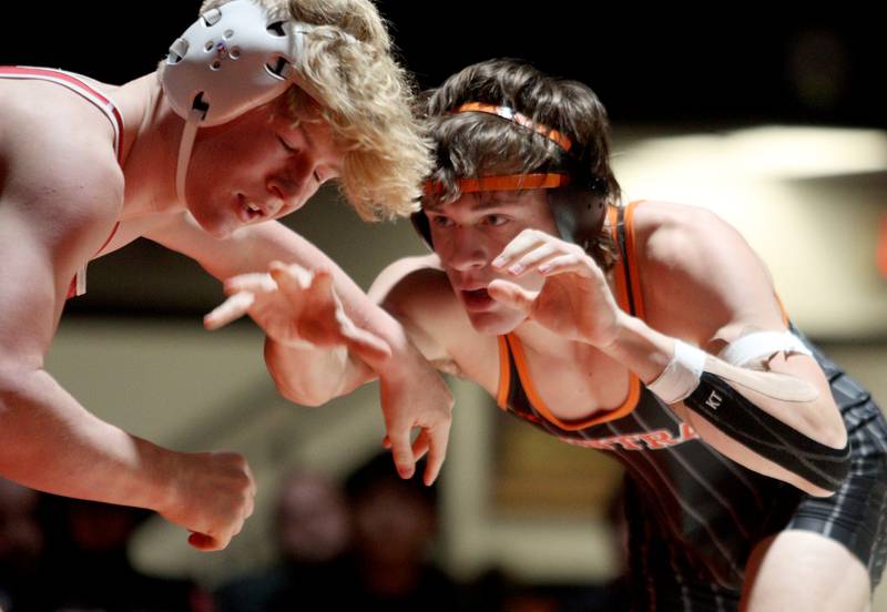 Crystal Lake Central’s Tommy Tomasello, right, battles Huntley’s Radic Dvorak in a 157-pound bout in varsity wrestling at Crystal Lake Friday. Dvorak won the match.