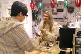 Downtown Crystal Lake shop heavily damaged in fire reopens for holidays, with a lot of help from its friends