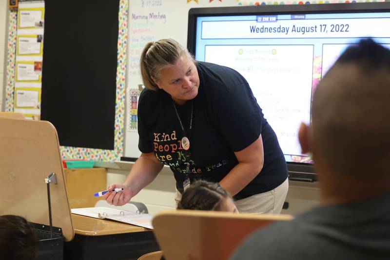 5th grade teacher Jennifer Kuefler checks her students in on the first day of school at Woodland Elementary School in Joliet. Wednesday, Aug. 17, 2022, in Joliet.
