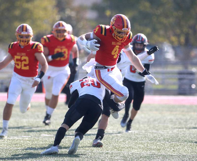 Batavia’s Charlie Whelpley leaps over Lincoln-Way Central’s Ben Rafferty during the Class 7A second round playoff game in Batavia on Saturday, Nov. 4, 2023.