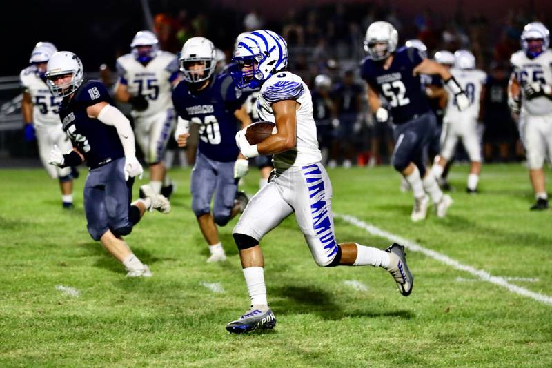 Princeton's Ace Christiansen breaks for  a long gain at Monmouth-Roseville Friday night. The Tigers won 40-0.