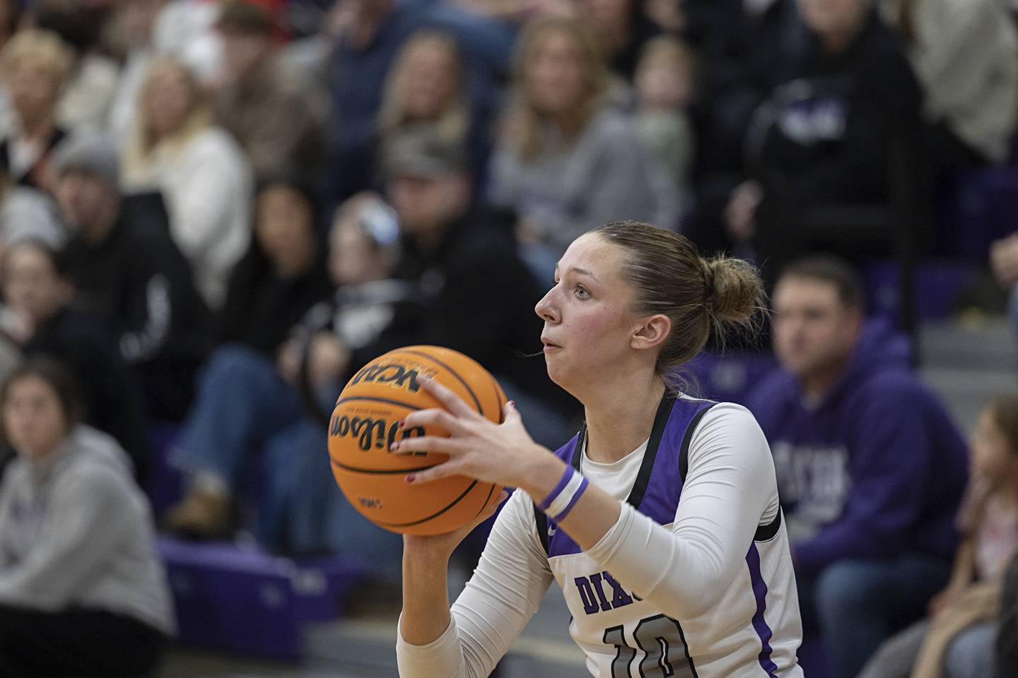 Dixon’s Addy Lohse spots up a three-pointer against Byron Saturday, Dec. 27, at the Duchesses Basketball Christmas Classic.