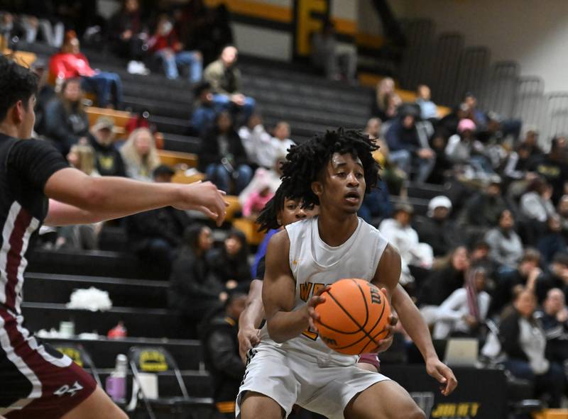 Joliet West's Nasir Sears (2) in action during a conference game against Plainfield North on Friday, Dec. 20, 2024, at Joliet.