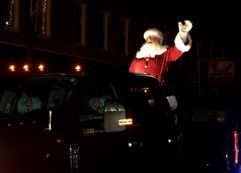 Santa waves to the crowds at the Plano Rockin’ Christmas Parade on Friday, Dec. 1, 2023 in Plano.