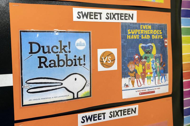 Pitzer chooses sixteen books, reads two of them at a time and lets the kids choose which one advances.