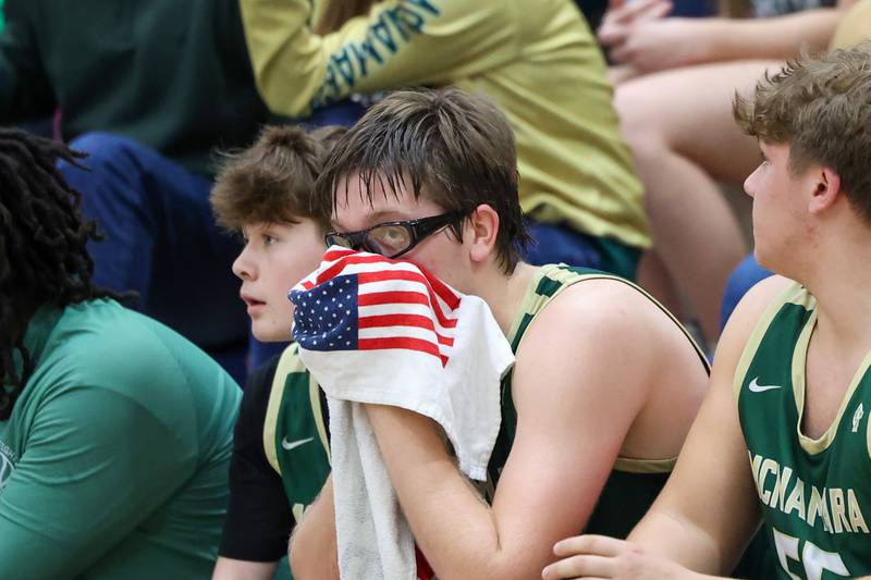 Bishop McNamara's Callaghan O'Connor looks to the scoreboard late in the fourth quarter during the Fightin' Irish's 77-70 loss to Tolono Unity in the IHSA Class 2A Pontiac Supersectional on Monday, March 9, 2026.