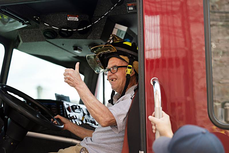 A big smile and thumbs up as Merlin sits in the cab of the Sterling firetruck Sunday, Sept. 17, 2023.