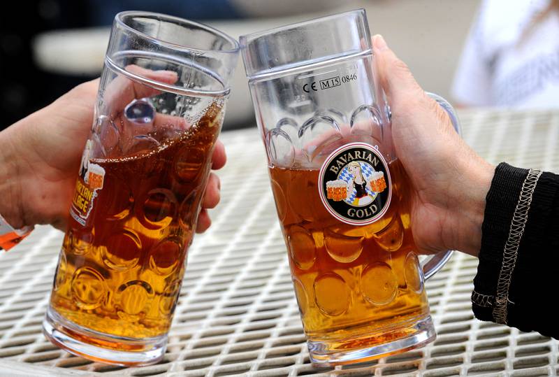 A toast with German beer, during Yorktoberfest, Saturday, Sept. 28, 2024, in Riverfront Park in Yorkville.