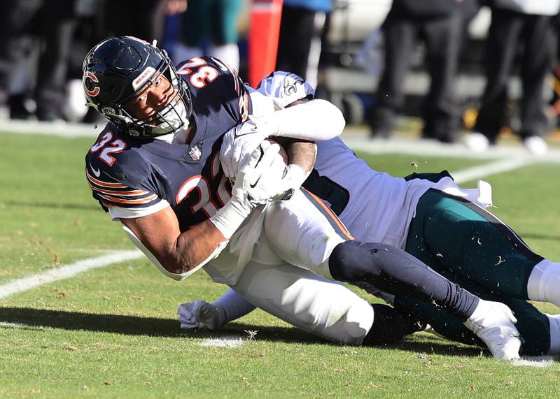 Chicago Bears running back David Montgomery is brought down by Philadelphia Eagles linebacker Kyzir White during their game Sunday, Dec. 18, 2022, at Soldier Field in Chicago.