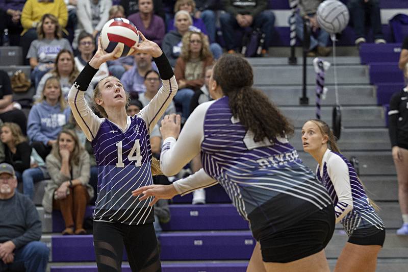 Dixon’s Leah Carlson sets the ball against Rock Falls Thursday, Oct. 12, 2023 at Dixon High School.