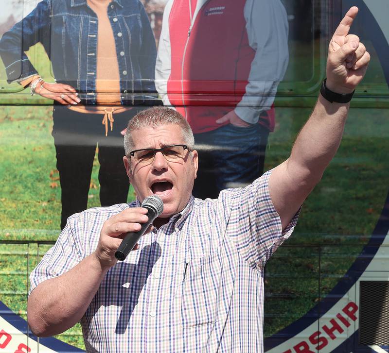 Darren Bailey, a Republican candidate for Illinois governor, speaks in front of his bus Friday, June 17, 2022, during his campaign stop at Tom and Jerry's in Sycamore. Bailey is currently on a bus tour across the state that will cover 102 countys in 14 days.