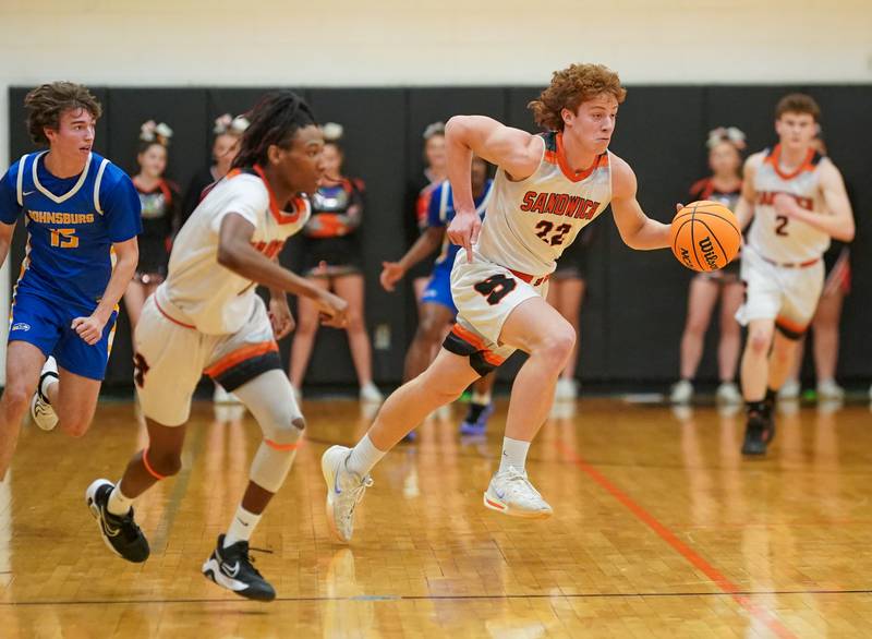 Sandwich’s Dom Rome (22) dribbles the ball up the court off of a steal against Johnsburg during a basketball game at Sandwich High School on Friday, January 31, 2025.