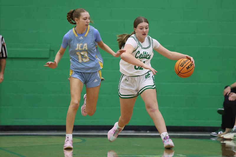 Providence’s Layken Callahan drives around Joliet Catholic’s Abigail Dulinsky on Saturday, Dec. 5, 2025 in New Lenox.