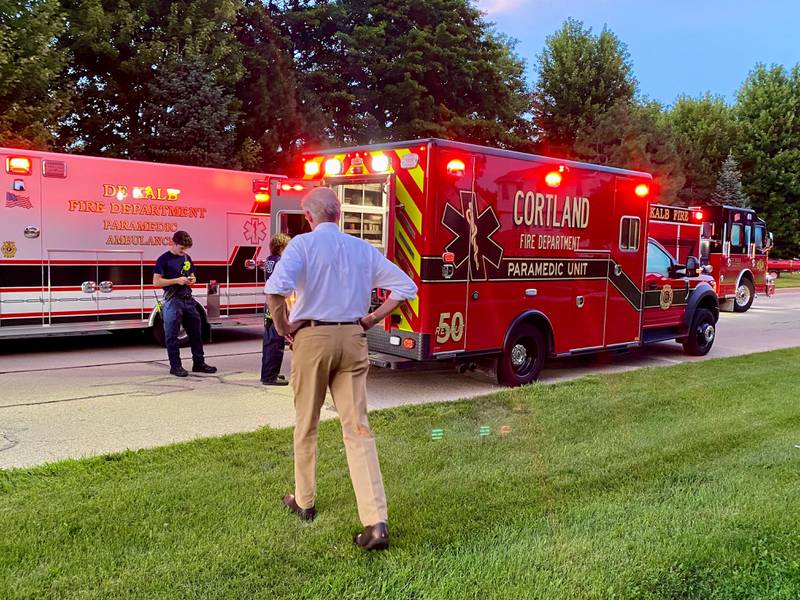 DeKalb City Manager Bill Nicklas walks toward DeKalb firefighters as dozens of first responders gather to undertake an emergency water rescue on Sunday, July 27, 2025, in the 600 block of Ridge Drive in DeKalb.
