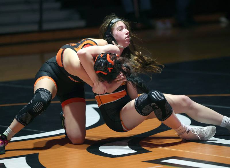 DeKalb’s Valeria Lopez (top) gets control of Kaneland’s Alena Padavana during their 125 pound match Wednesday, Jan. 7, 2026, at DeKalb High School.