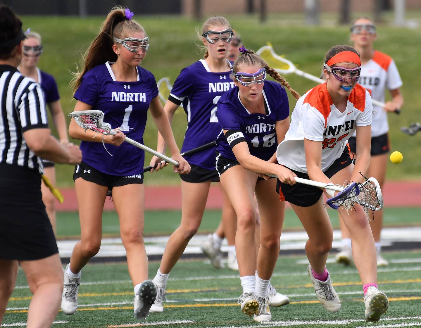 Crystal Lake’s Anna Starr (right) and Downers Grove North’s Ashley Poquette tangle for the ball during the Benet Supersectional game on June 3, 2025 at College of DuPage in Glen Ellyn.