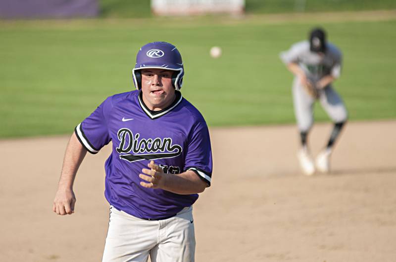 Dixon’s Mitchell White chugs to third against North Boone Thursday, May 12, 2022.