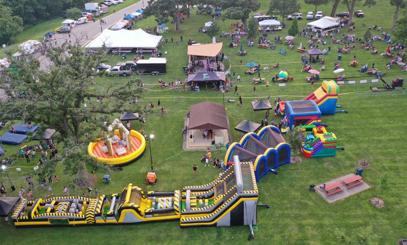 An aerial view of the fun zone during the The Taste of the Illinois Valley on Friday, Aug. 1, 2025 at Centennial Park in Peru. The event featured food vendors, live music, a beer tent and a kids zone, Dreamwave wrestling and Pandora's Box, a Aerosmith tribute band.