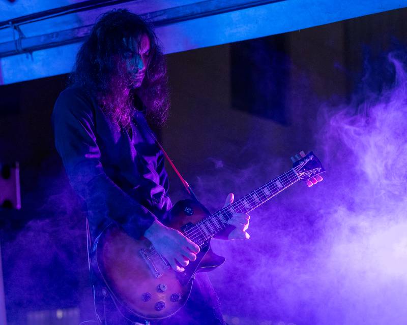 Marco Obaya of Harmonix plays guitar during the band's performance at Frosty on First on Friday, November 7, 2025 on First Street in La Salle.