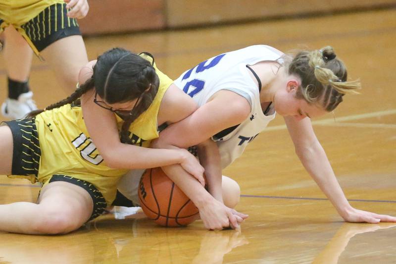 Putnam County's Addy Leatherman and Princeton's Keighley Davis force a jump ball during the Princeton Holiday Girls Basketball Tournament on Tuesday, Nov. 19, 2024 at Princeton High School.