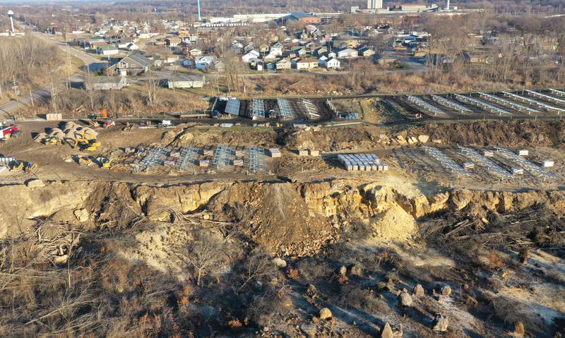 Crews prepare to erect a glass panel on the solar farm located in the 1400 block of North 27th Road (Dee Bennett Road) on Wednesday, Jan. 8, 2026 in Naplate.