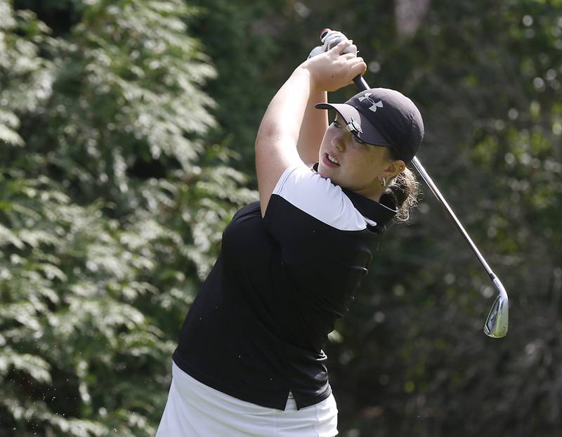 Crystal Lake Co-op’s Delaney Medlyn watches her tee shot on the ninth hole during the Fox Valley Conference Girls Golf Tournament Wednesday, Sept. 21, 2022, at Crystal Woods Golf Club in Woodstock.