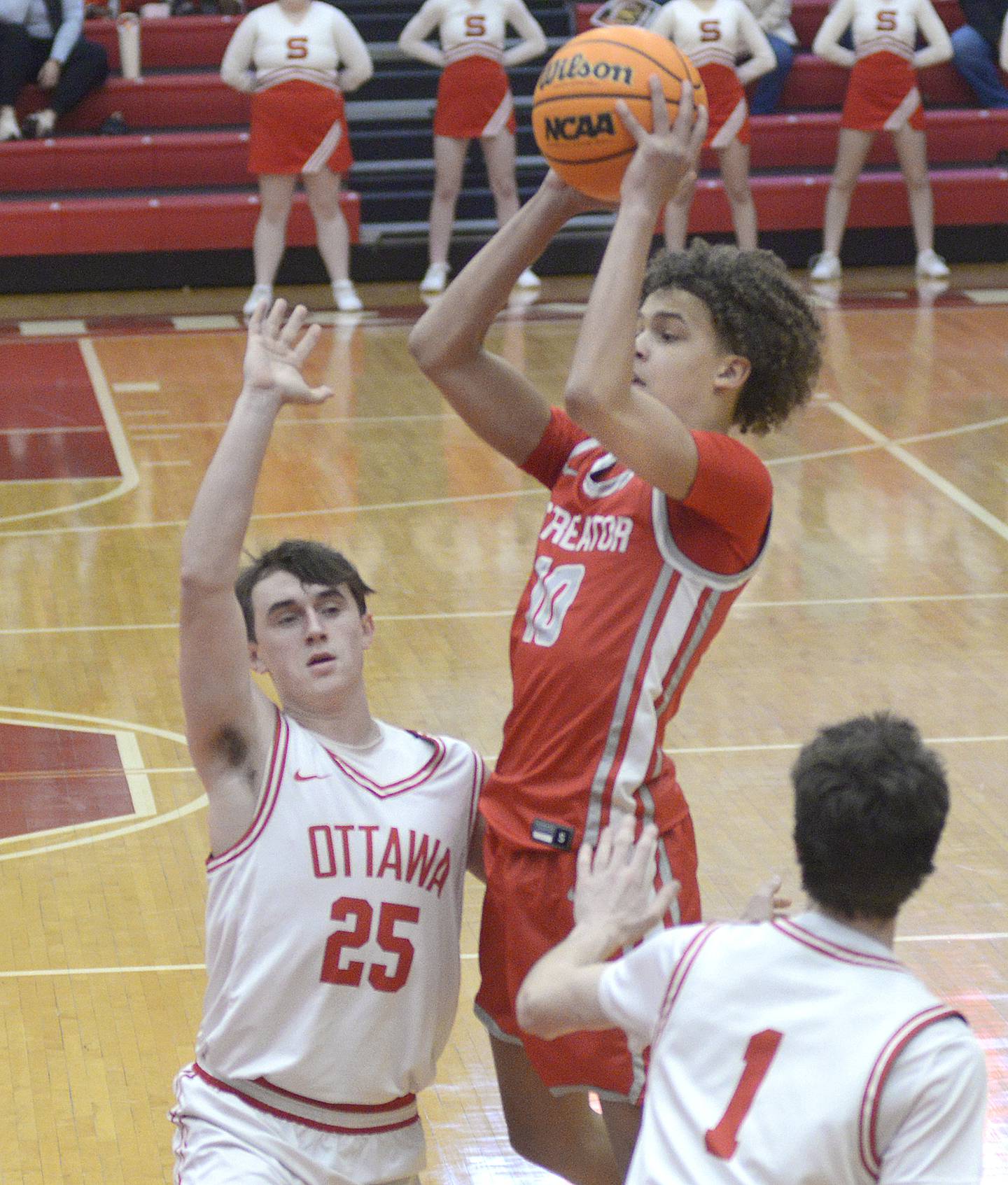 Streator’s Christian Bruton shoots over the block attempt by Ottawa’s Lucas Farabaugh in the 1st period Saturday at Ottawa.